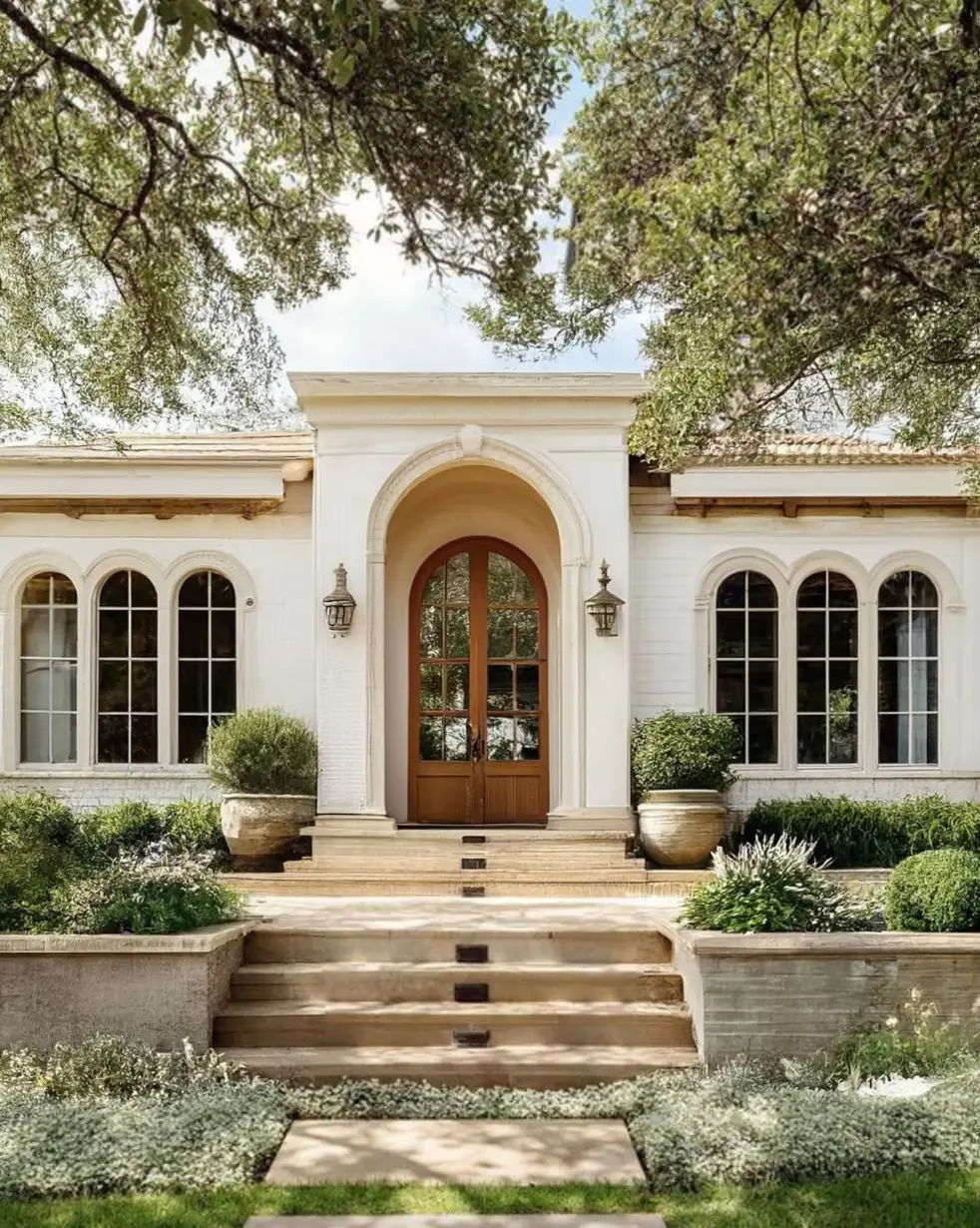 Traditional Exterior Remodel with Large Windows and Greenery