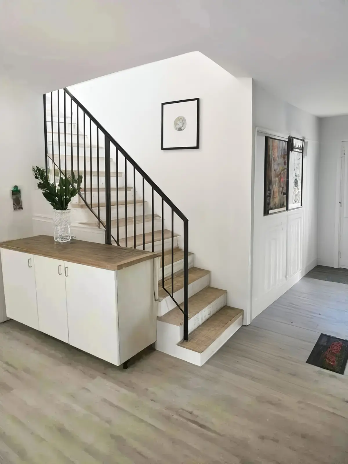 Scandinavian Hallway Remodel with Black Railings