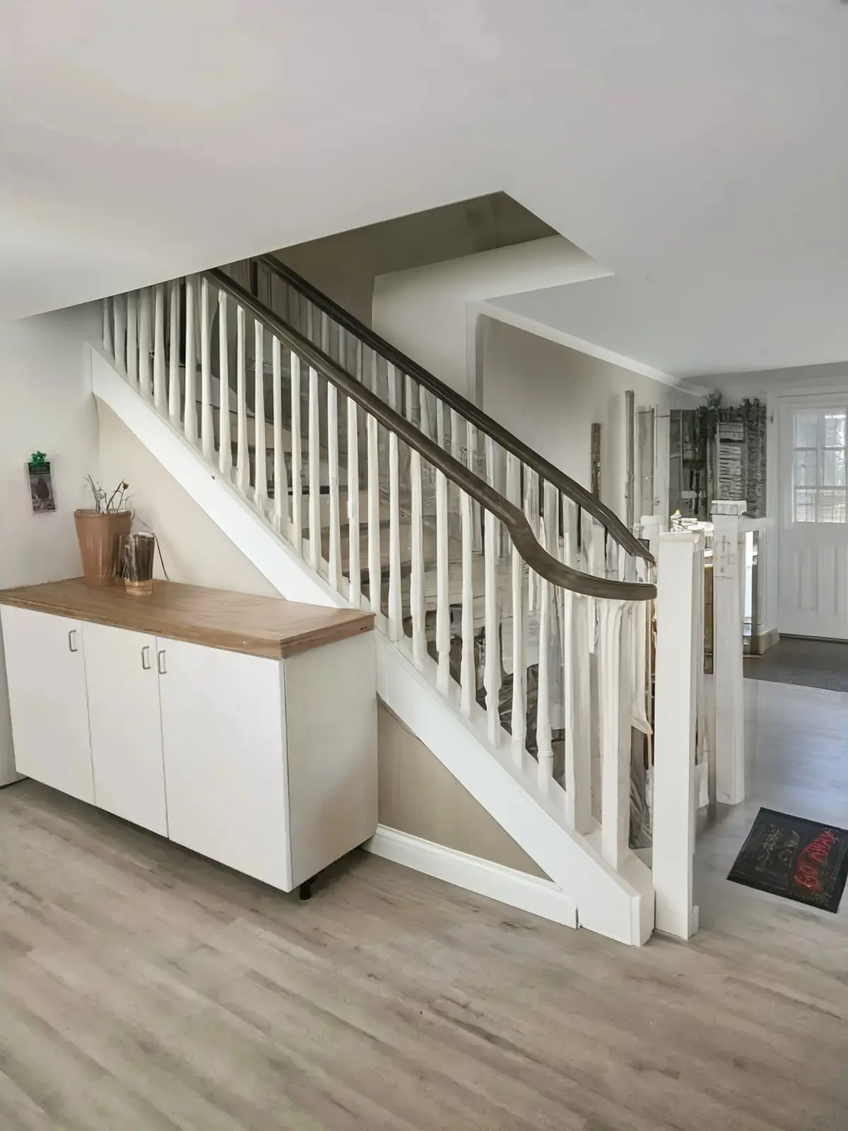 Traditional Hallway Remodeling with White Railings and Black Spindles