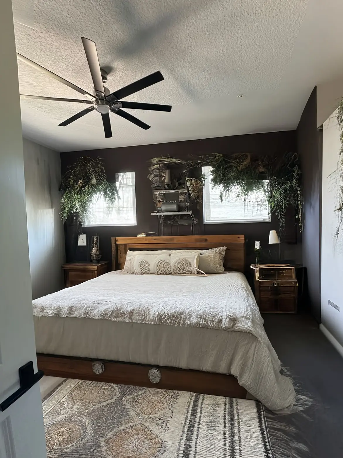 Rustic Bedroom Transformation with Dark Tones and Cozy Elements