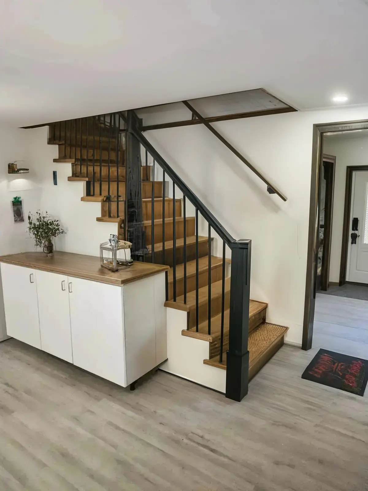 Rustic Hallway Remodel with Black Railings