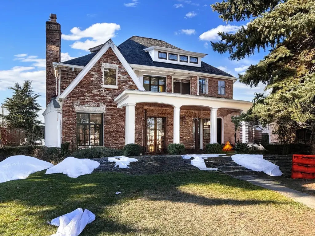 Traditional Brick Exterior Remodel with Porch & Landscaping