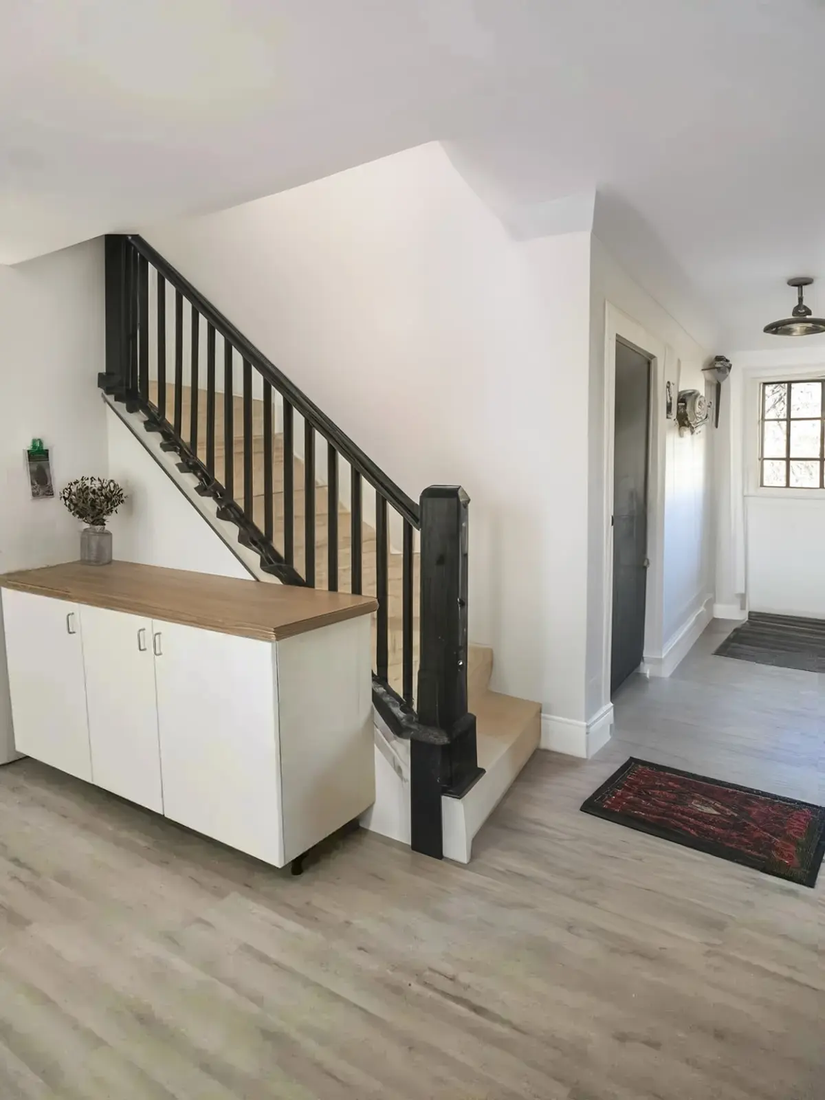 Rustic Hallway Remodel with Black Railing