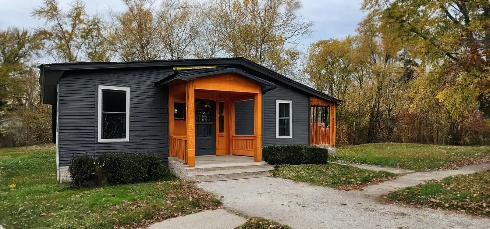 Modern Exterior Remodel with Cedar Porch and Fenced Yard