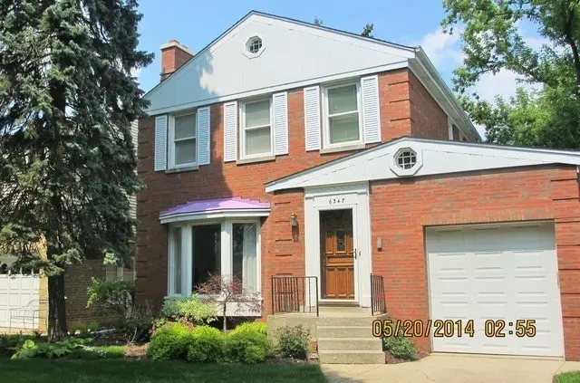 <p>Craft a highly realistic representation of a two-story, red-brick house having a breadth of roughly 30 feet. Upgrade its historic facade with modern elements, including streamlined, metal shutters and energy-efficient windows. The garage, attached to the right of the building, should flaunt a new style defined by frosted glass panels. The entryway should be renewed with a sleek, glass-paneled front door and large, contemporary numerals representing the house number. Surround the property with contemporary, minimalistic landscaping, characterized by tall grasses and geometric-shaped bushes.</p>