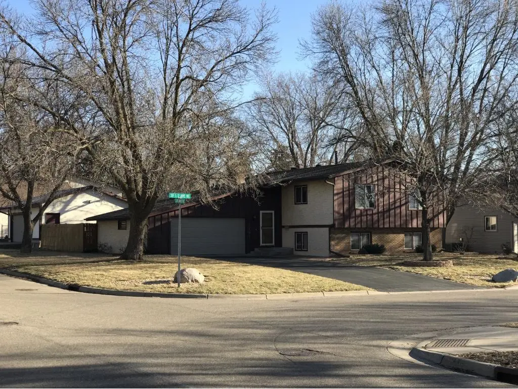 <p>Create an ultra-realistic illustration of a refurbished split-level suburban home's exterior. The building boasts warm-hued, contemporary wooden panel siding. Incorporate substantial, power-saving windows to allow plenty of sunlight. The front yard is landscaped with indigenous plants, and a cobblestone path leads to the main door. Place a few modern outdoor lighting fixtures. The garage door is technologically advanced and made with eco-friendly materials. The house's measurements should be about 50 feet wide and 30 feet high. Include tall, mature trees and a serene road to provide a welcoming ambiance.</p>