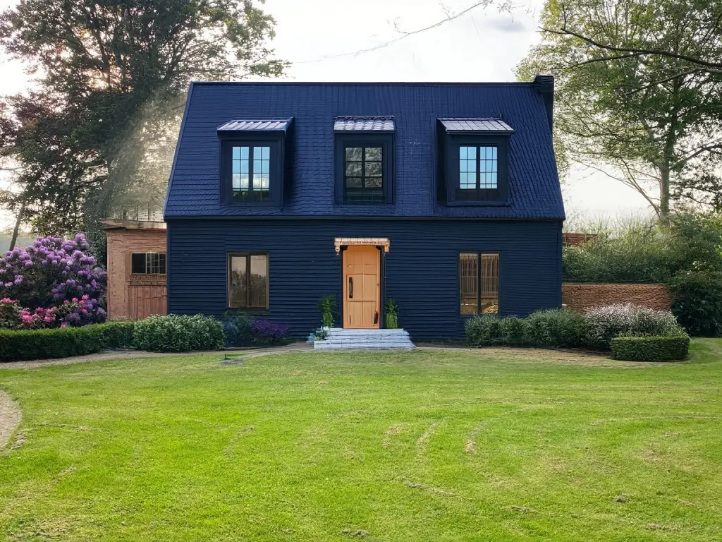 Industrial Exterior Remodel with Black-Framed Windows and Wooden Door