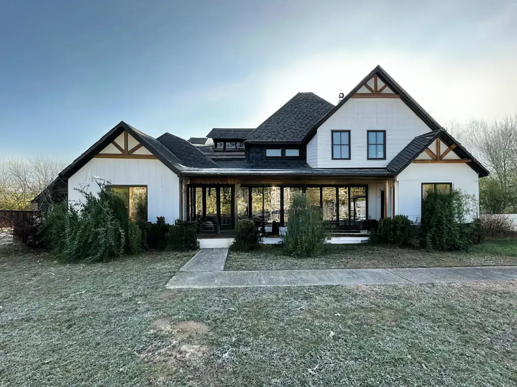 Modern Farmhouse Exterior Remodel with Porch and Wood Beams