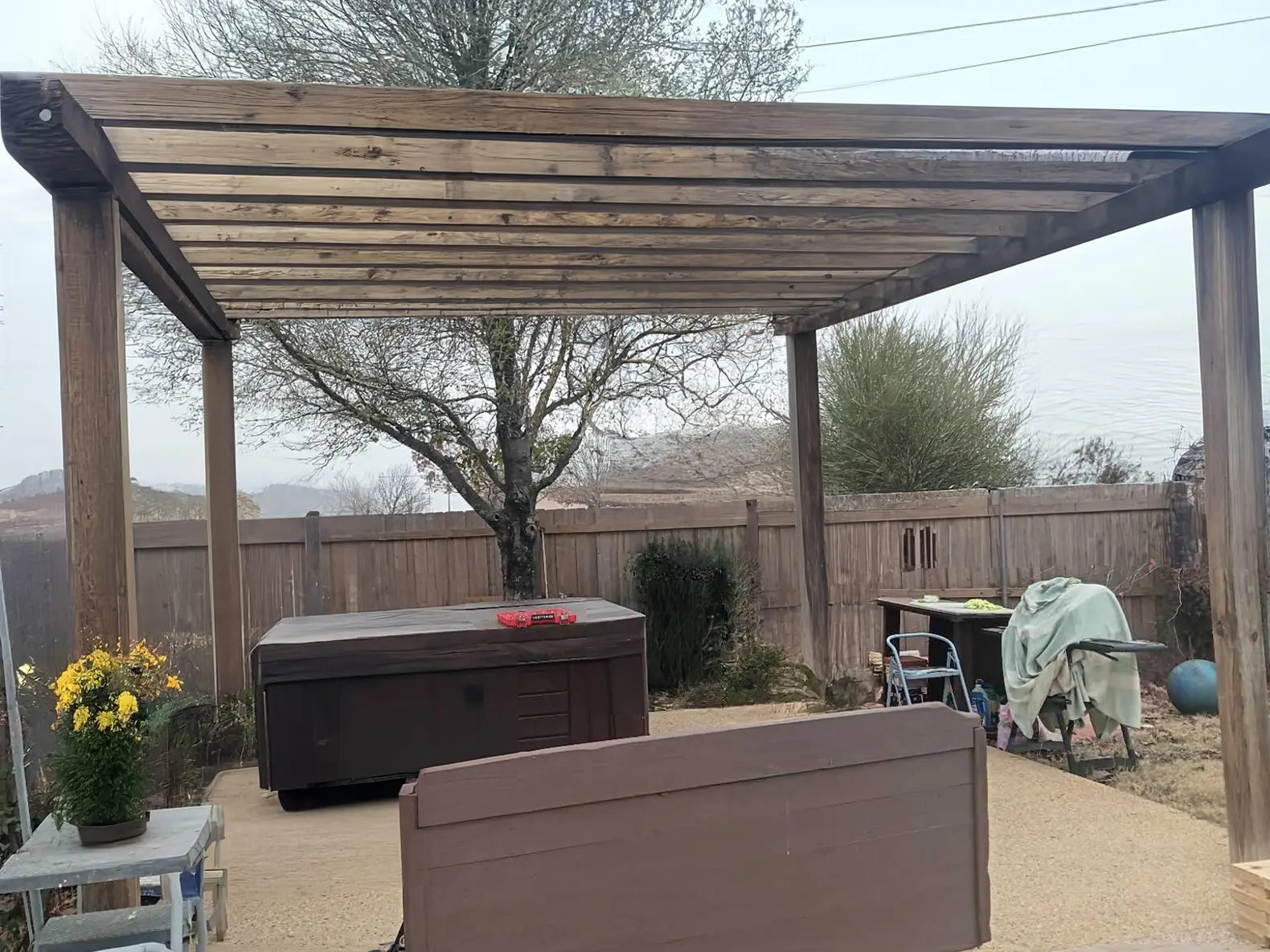 Revamp Your Backyard Patio with a Stunning Pergola and Hot Tub