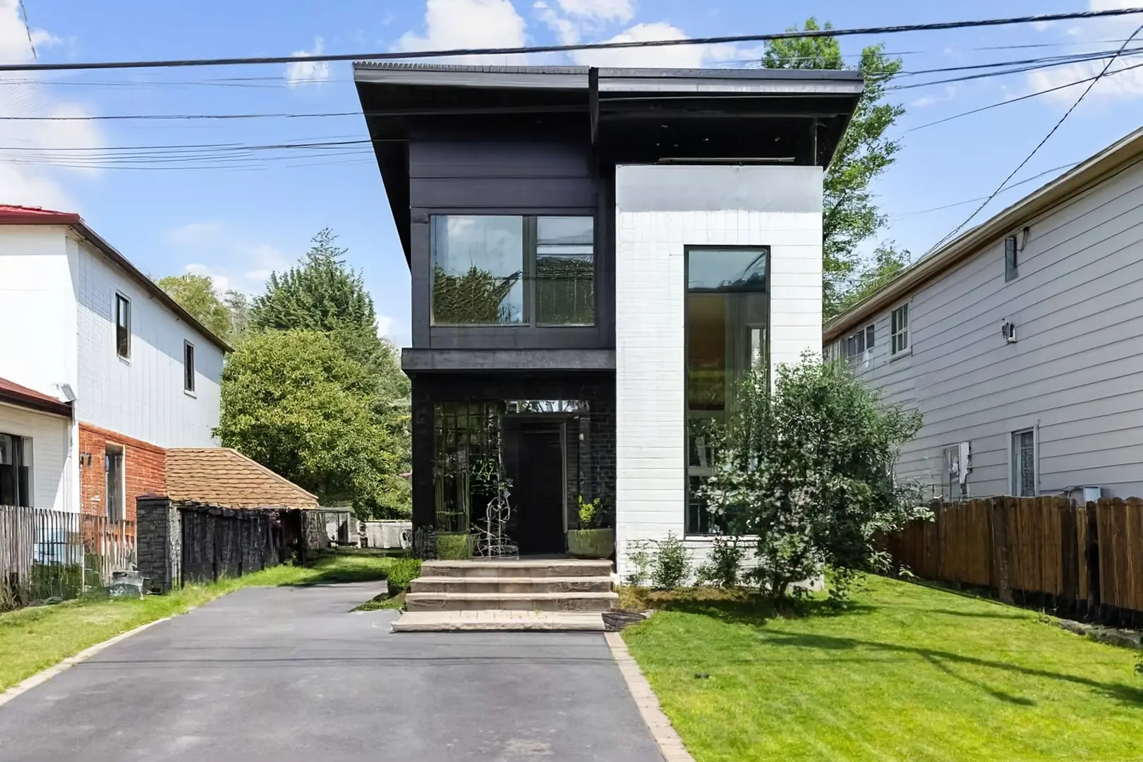 Modern Minimalistic Exterior Design with Black and Wood Accents