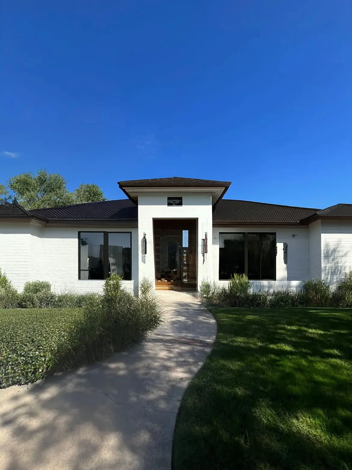 Transitional Home Exterior Remodel: Modern Elegance with Brick and Copper